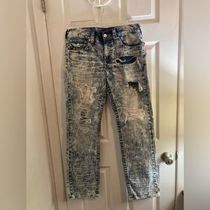 Distressed True Religion Jeans with red stitching